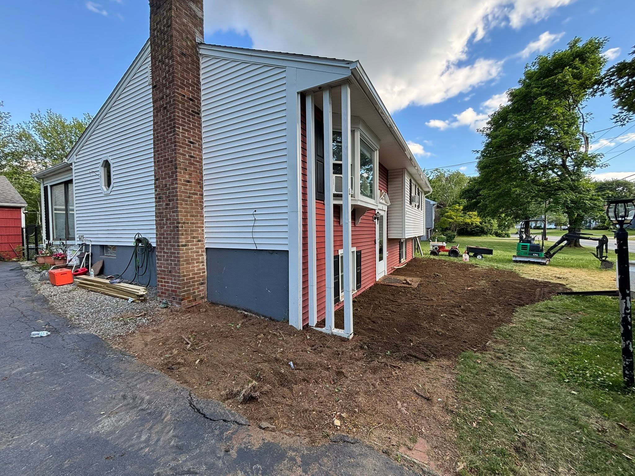 Finished clearing — open area ready for loam or new planting